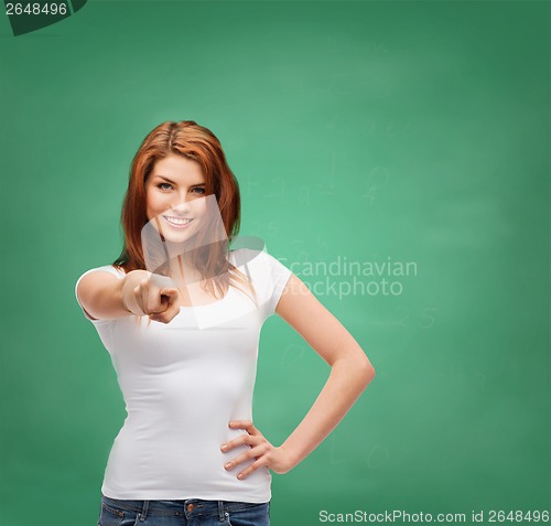 Image of teenager in blank white t-shirt pointing at you