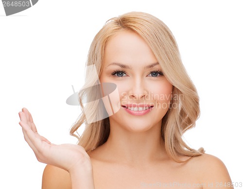 Image of smiling woman holding something imaginary