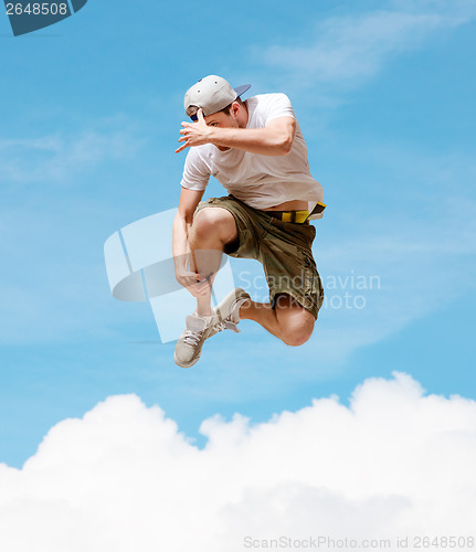 Image of male dancer jumping in the air