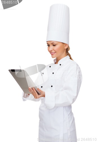 Image of smiling female chef with tablet pc computer