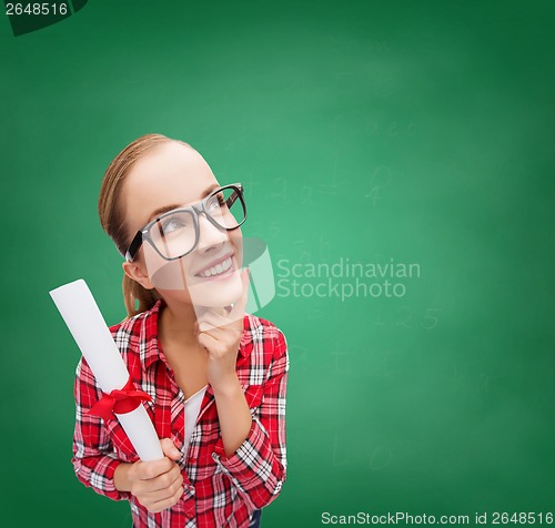 Image of smiling woman in black eyeglasses with diploma