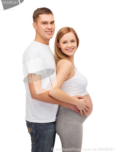 Image of happy young family expecting child