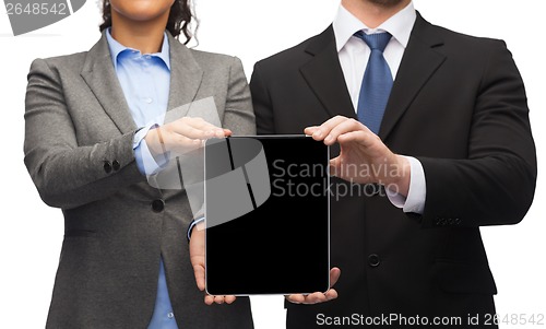 Image of businessman and businesswoman with tablet pc