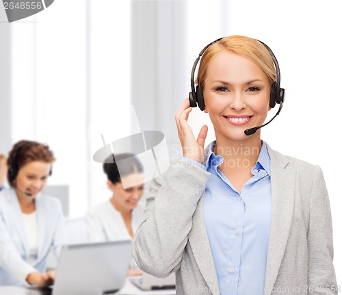 Image of friendly female helpline operator at office