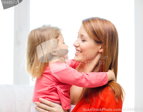 Image of hugging mother and daughter