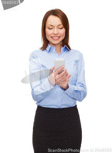 Image of young smiling businesswoman with smartphone