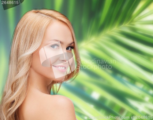 Image of face and shouldes of happy woman with long hair