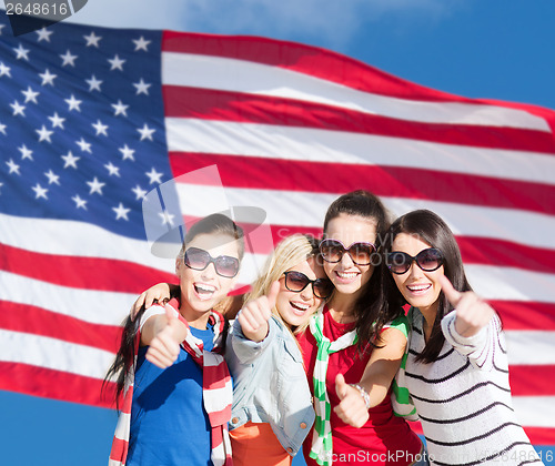 Image of teenage girls or young women showing thumbs up