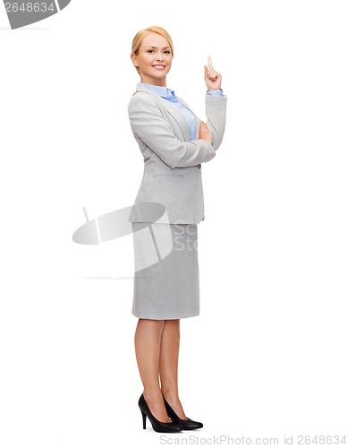 Image of smiling businesswoman with her finger up