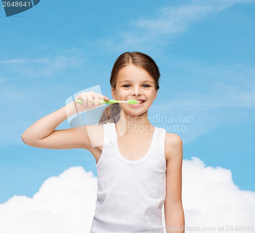 Image of girl in blank white shirt brushing her teeth