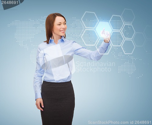 Image of smiling businesswoman working with virtual screen