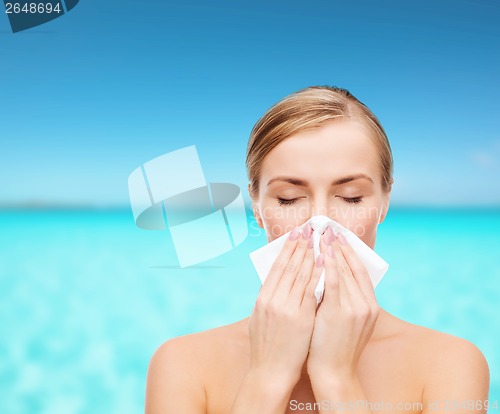 Image of beautiful woman with paper tissue