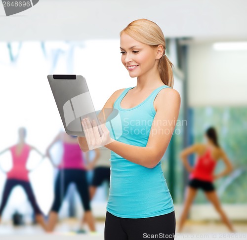 Image of sporty woman with tablet pc