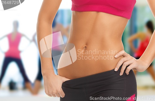 Image of woman trained abs