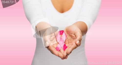 Image of hands holding pink breast cancer awareness ribbon