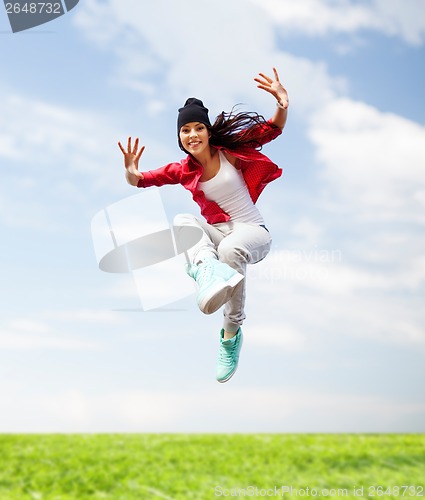 Image of beautiful dancing girl jumping