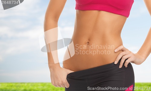Image of woman trained abs