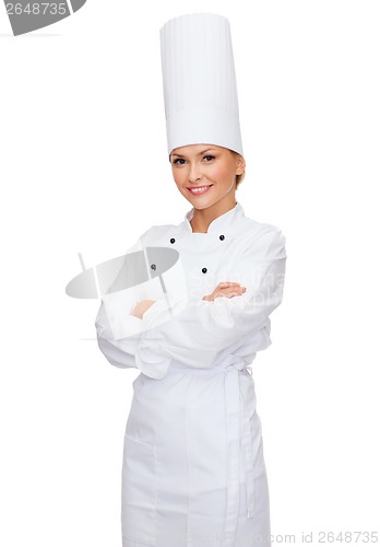 Image of smiling female chef with crossed arms