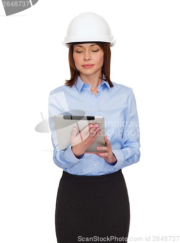 Image of young calm businesswoman in white helmet