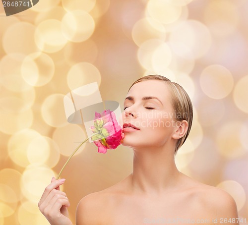 Image of lovely woman with peonie flower