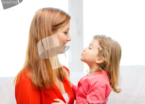 Image of hugging mother and daughter