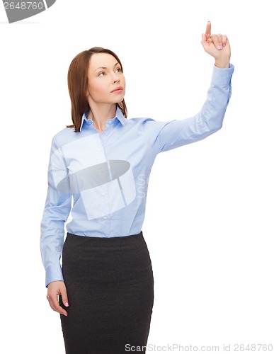 Image of calm businesswoman working with virtual screen