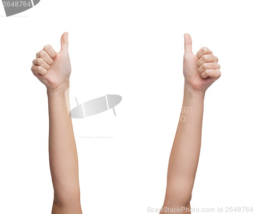 Image of woman hands showing thumbs up