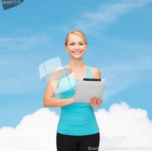 Image of sporty woman with tablet pc