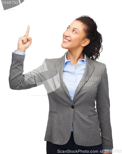 Image of smiling businesswoman with her finger up