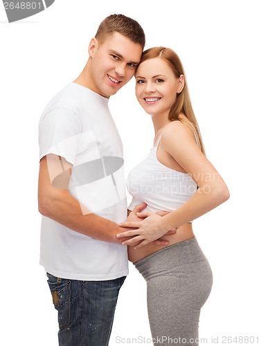 Image of happy young family expecting child