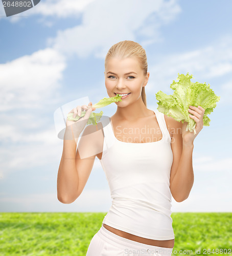 Image of woman biting lettuce