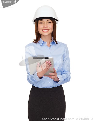 Image of young smiling businesswoman in white helmet