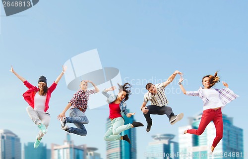 Image of group of teenagers jumping