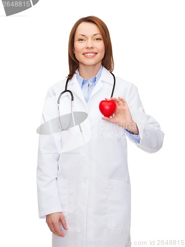 Image of smiling female doctor with heart and stethoscope