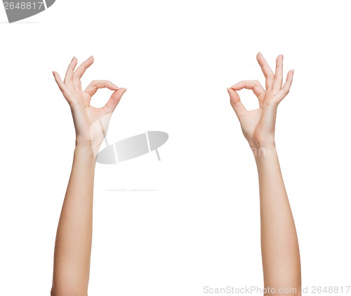 Image of woman hands showing ok sign