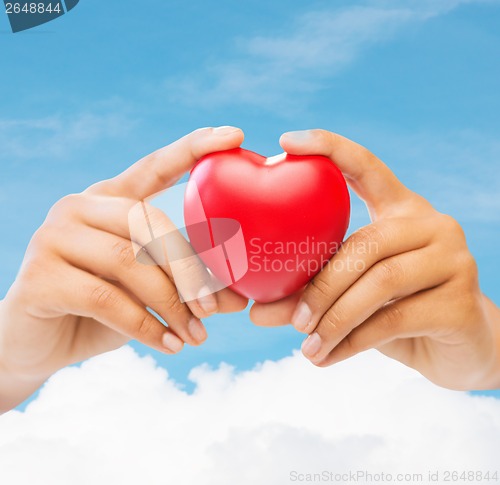 Image of female hands with heart