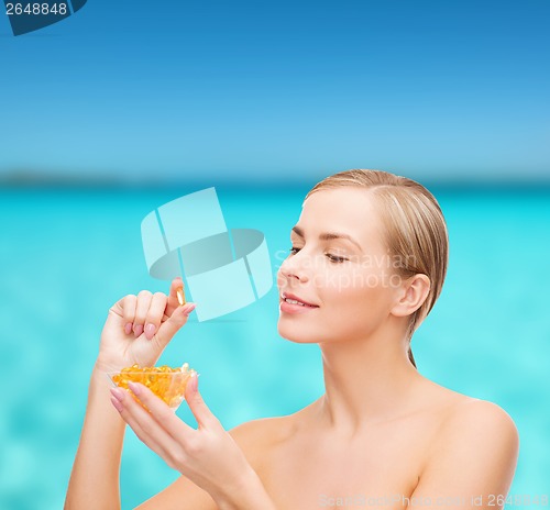 Image of lovely woman with omega 3 vitamins