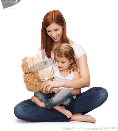 Image of happy mother with adorable girl and teddy bear