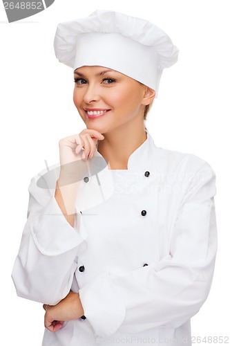 Image of smiling female chef dreaming