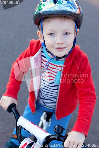 Image of boy riding bicycle