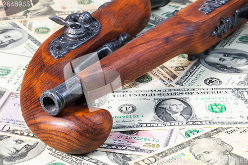 Image of Old guns and money and money