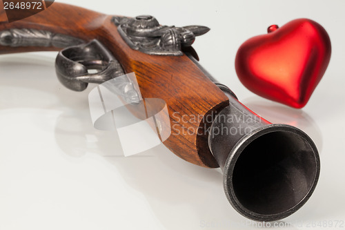 Image of Old gun and red heart