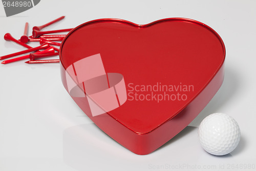 Image of Red heart and golf ball and tees