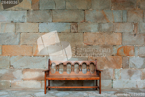 Image of The empty bench on the promenade at the monastery