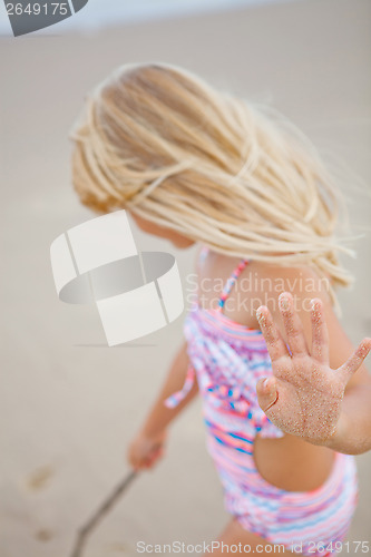 Image of Young girl having fun at beach