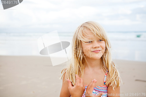 Image of Happy cute young girl at beach