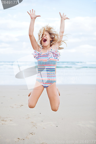 Image of Young girl having fun at beach