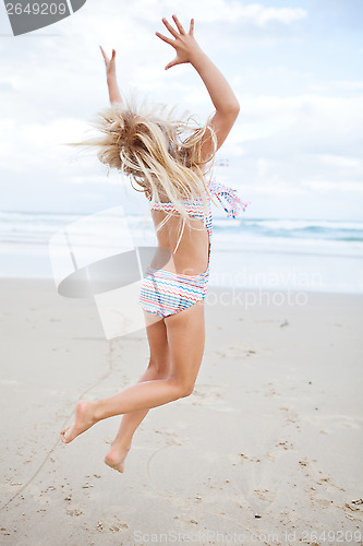 Image of Young girl having fun at beach