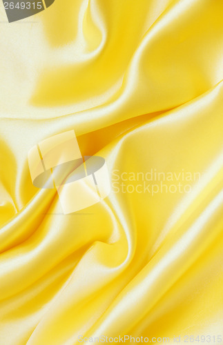 Image of Smooth elegant golden silk as background 