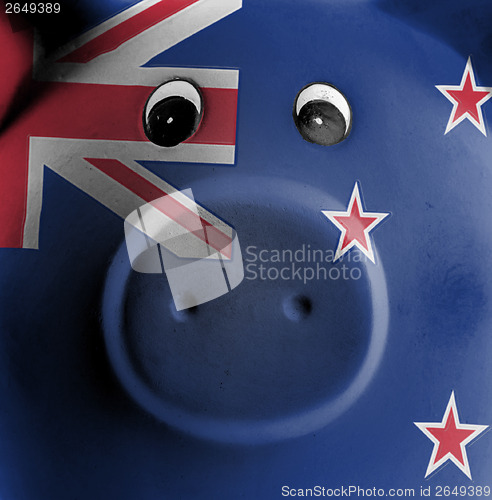 Image of Ceramic piggy bank with painting of national flag 